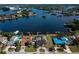 High-angle shot of waterfront houses emphasizing the coastal community's beautiful scenery and property features at 828 Bayshore Dr, Tarpon Springs, FL 34689