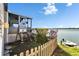 Backyard featuring a screened lanai with a glimpse of the lake at 8528 Fantasia Park Way, Riverview, FL 33578