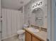 Bathroom with shower/tub, toilet, vanity, and mirrored wall cabinet at 8528 Fantasia Park Way, Riverview, FL 33578