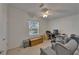 Bedroom featuring neutral carpet, ceiling fan, and a work desk at 8528 Fantasia Park Way, Riverview, FL 33578