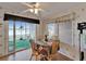 Bright dining area featuring waterfront views and seating for four under a ceiling fan at 8528 Fantasia Park Way, Riverview, FL 33578