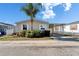 Charming single-story home featuring a covered carport and mature landscaping at 8528 Fantasia Park Way, Riverview, FL 33578
