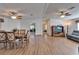 Bright and open living room and dining area featuring wood floors and ceiling fans at 8528 Fantasia Park Way, Riverview, FL 33578
