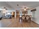 Open-concept living and dining area with hardwood floors and lots of seating at 8528 Fantasia Park Way, Riverview, FL 33578
