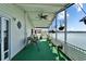 Inviting patio with swing, ceiling fan, and a view of the waterfront at 8528 Fantasia Park Way, Riverview, FL 33578