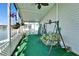 Covered patio featuring a swing and view of the water at 8528 Fantasia Park Way, Riverview, FL 33578