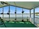 Waterfront patio featuring hanging plants and views of the serene lake at 8528 Fantasia Park Way, Riverview, FL 33578