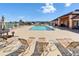 Community pool with plenty of chairs and a covered seating area for residents to relax at 8528 Fantasia Park Way, Riverview, FL 33578