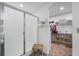 Clean bathroom featuring a walk-in shower and ample closet space at 8975 Southern Charm Cir, Brooksville, FL 34613