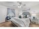 Comfortable bedroom with plush carpet, ceiling fan, and calming decor at 8975 Southern Charm Cir, Brooksville, FL 34613