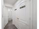 Hallway with Laundry Room entrance and doorway to the bathroom at 8975 Southern Charm Cir, Brooksville, FL 34613
