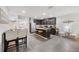 Open kitchen featuring stainless steel appliances, a center island, and views to the dining area at 8975 Southern Charm Cir, Brooksville, FL 34613