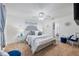 Comfortable main bedroom with plush carpet, ceiling fan, and calming decor at 8975 Southern Charm Cir, Brooksville, FL 34613