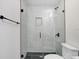 Modern bathroom featuring a glass-enclosed shower with black trim and sleek hardware at 9481 Highland Oak Dr # 514, Tampa, FL 33647