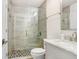 Stylish bathroom with glass enclosed shower, modern tiling, updated vanity and sink at 9481 Highland Oak Dr # 514, Tampa, FL 33647