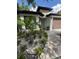 Attractive front yard with lush landscaping, decorative stones, and a charming facade at 2917 W Fern St, Tampa, FL 33612