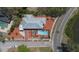 Aerial of home featuring backyard pool, landscaping, brick paved driveway, and charming neighborhood at 101 Pampas Ave, Tarpon Springs, FL 34689
