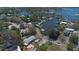 An aerial shot showcasing the house, pool, and surrounding waterfront neighborhood at 101 Pampas Ave, Tarpon Springs, FL 34689
