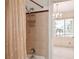 Charming bathroom featuring vintage tilework, a shower, and a glimpse into the bedroom at 101 Pampas Ave, Tarpon Springs, FL 34689