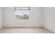 Cozy bedroom with a large window showcasing a view of the serene waterfront at 101 Pampas Ave, Tarpon Springs, FL 34689