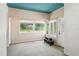 Inviting sunroom with large windows, offering ample natural light and garden views at 101 Pampas Ave, Tarpon Springs, FL 34689