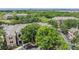 Aerial view of property showcasing surrounding greenery, architecture, and neighborhood layout at 10103 Courtney Oaks Cir # 103, Tampa, FL 33619