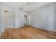 A well-lit bedroom with hardwood floors, ceiling fan, and neutral walls at 10103 Courtney Oaks Cir # 103, Tampa, FL 33619