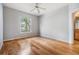 Light filled room with wood floors and a bright window with a neighborhood view at 10103 Courtney Oaks Cir # 103, Tampa, FL 33619