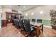 Professional conference room featuring a large table, executive chairs, and modern lighting for meetings at 10103 Courtney Oaks Cir # 103, Tampa, FL 33619