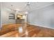 Open living room area featuring hardwood floors and neutral paint at 10103 Courtney Oaks Cir # 103, Tampa, FL 33619