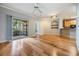 Spacious living room with hardwood floors, access to balcony, and an open layout at 10103 Courtney Oaks Cir # 103, Tampa, FL 33619