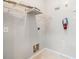 Functional utility room with shelving, outlets, and connections for appliances, offering practical storage space at 10103 Courtney Oaks Cir # 103, Tampa, FL 33619