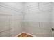 A walk-in closet featuring white wire shelving and hardwood floor at 10103 Courtney Oaks Cir # 103, Tampa, FL 33619