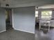 Bright kitchen with white cabinets, black appliances, and eat-in table and chairs at 10106 66Th Ave, Seminole, FL 33772