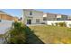 Fenced backyard with green lawn and patio at 10230 Geese Trail Cir, Sun City Center, FL 33573