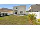 Fenced backyard with green lawn and patio at 10230 Geese Trail Cir, Sun City Center, FL 33573