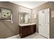 Bathroom with double vanity and modern lighting at 10230 Geese Trail Cir, Sun City Center, FL 33573