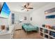 bedroom showcases playful Stitch-themed decor, a cozy bed, and ample natural light at 10230 Geese Trail Cir, Sun City Center, FL 33573