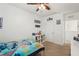 Bright bedroom features Stitch-themed decor, a comfortable bed, and ample storage at 10230 Geese Trail Cir, Sun City Center, FL 33573