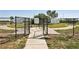 Community dog park with separate areas for large and small dogs, enclosed by secure fencing at 10230 Geese Trail Cir, Sun City Center, FL 33573