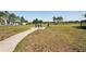 Outdoor dog park with a bench and waste station, providing a dedicated space for pets to play at 10230 Geese Trail Cir, Sun City Center, FL 33573