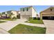 Two-story home with a driveway and attached garage at 10230 Geese Trail Cir, Sun City Center, FL 33573