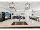 Open concept kitchen with an island sink, and a view into the living area at 10230 Geese Trail Cir, Sun City Center, FL 33573