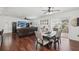 Open-concept living and dining area with a large sectional couch at 10230 Geese Trail Cir, Sun City Center, FL 33573