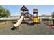 Community playground featuring a wooden playset with a slide and climbing structure at 10230 Geese Trail Cir, Sun City Center, FL 33573
