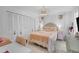 Bright bedroom featuring a rattan headboard, closet, and stylish decor at 1137 86Th N Ave, St Petersburg, FL 33702