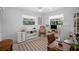 Bright bedroom with windows, neutral colors, and built-in shelving units at 1137 86Th N Ave, St Petersburg, FL 33702