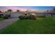 Charming home with lush green lawn, beautiful landscaping, and attached two car garage at 1137 86Th N Ave, St Petersburg, FL 33702