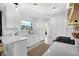 Well-lit kitchen with sleek countertops, stainless steel appliances, lots of cabinet space, and a garden view at 1137 86Th N Ave, St Petersburg, FL 33702