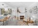 Open-concept living space featuring a fireplace, floating shelves, and a kitchen view at 1137 86Th N Ave, St Petersburg, FL 33702